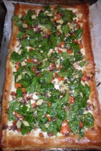 Full tart with salad spread over top.