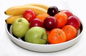 Bowl with apples, oranges, plums, and bananas.