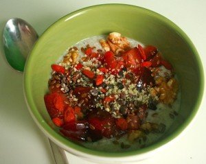 Oatmeal with cream, nuts, and berries.